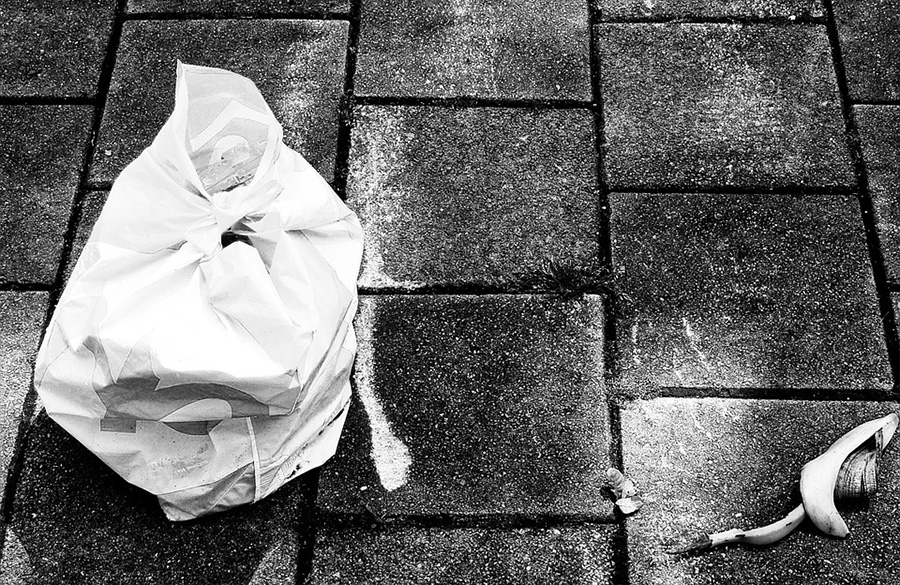 bag on street with banana skin